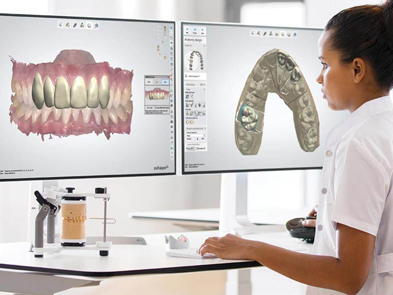 Dentist working with scans of teeth using a special program