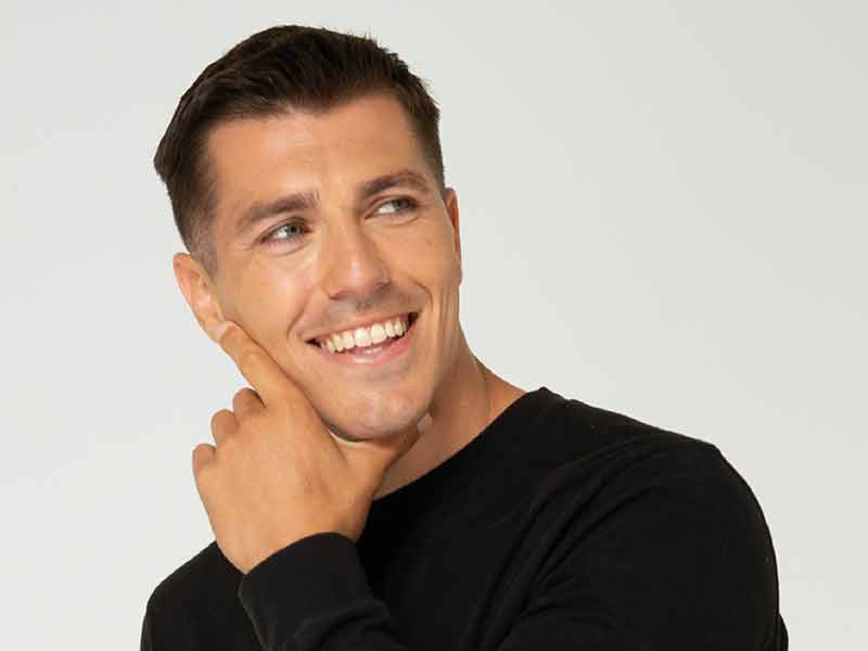 Man with hands on chin, thinking.