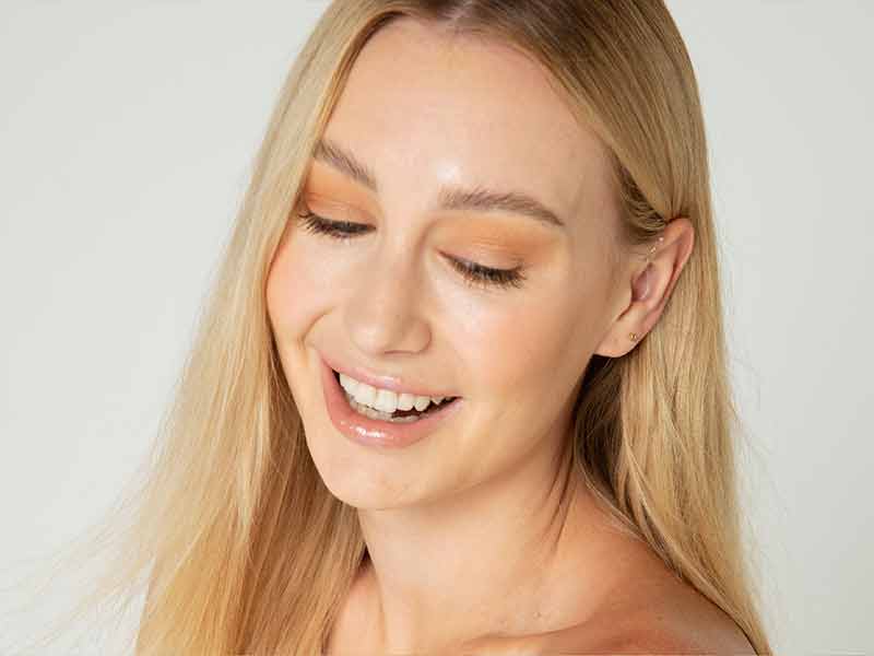 Woman with whitened teeth smiling
