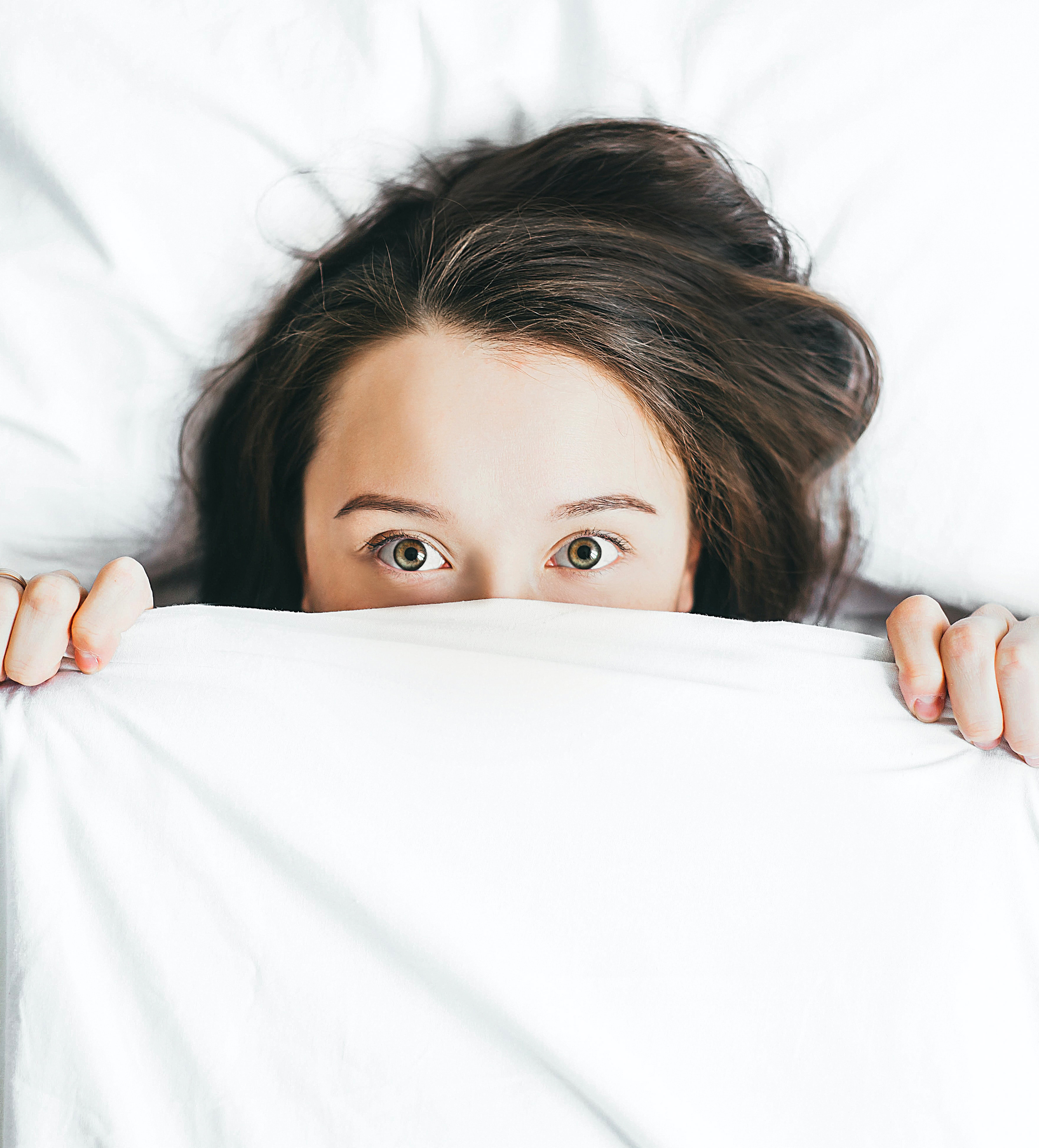 Middle aged man in dental treatment room looking at himself in the mirror
