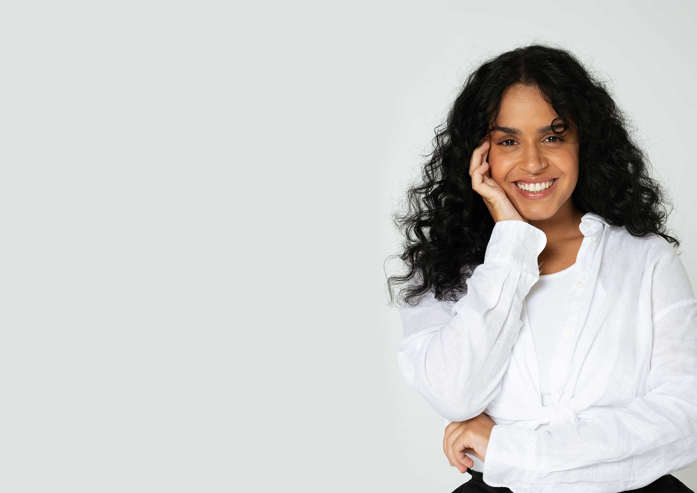 Woman with a bright white smile.