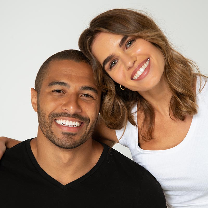 Couple with whitened teeth smiling